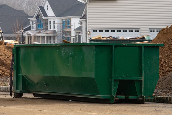 properly loading a construction dumpster involves strategically placing items to make the most of the available space